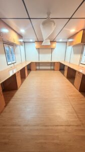 Portable Office Cabin Interior with Wooden Flooring and Office Furniture